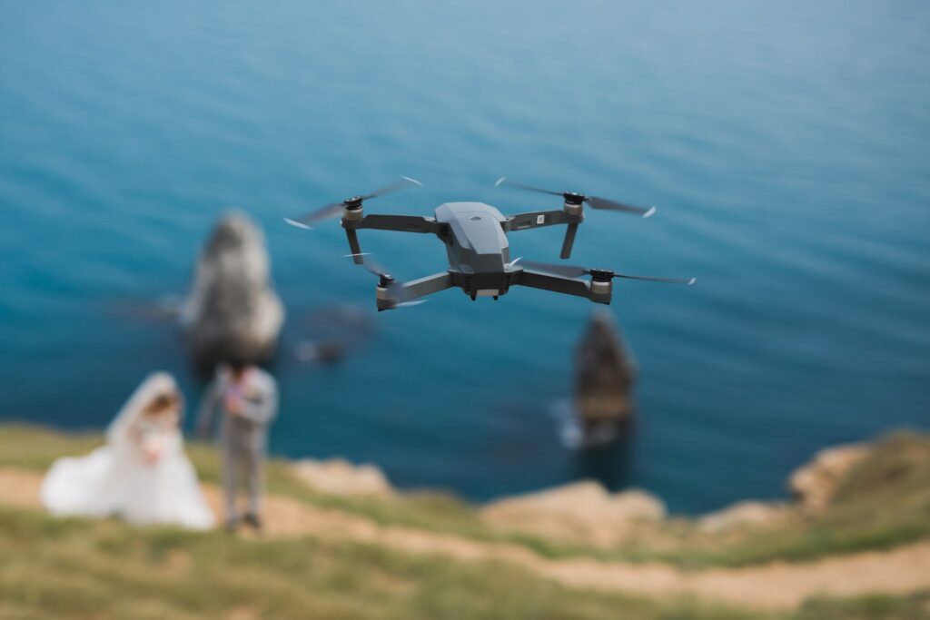 "A drone flying over a landscape, showcasing aerial innovation in Photography Trends July 2025.
