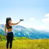 A photographer reviving film techniques with a camera, central to Photography Trends July 2025.