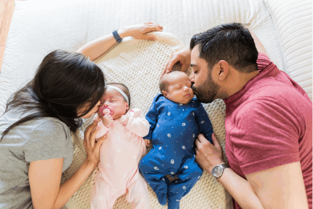Parent cradling a newborn in their arms, highlighting natural connection in newborn photography posing ideas for beginners.
