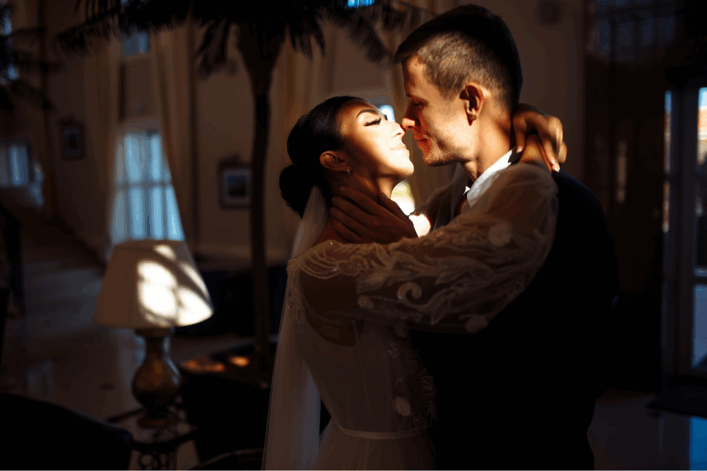 Romantic wedding portrait of a bride and groom embracing in golden light, captured by one of the best wedding photographers 2025.