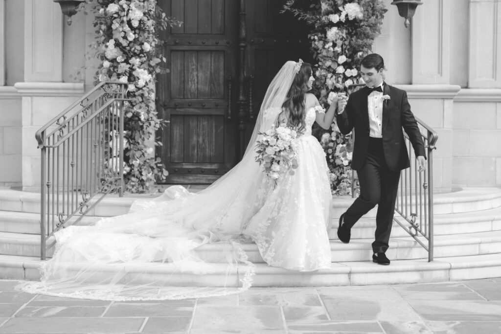 Bride and groom walking down the church stairs, captured to highlight the excitement and emotion preserved through same-day edits.