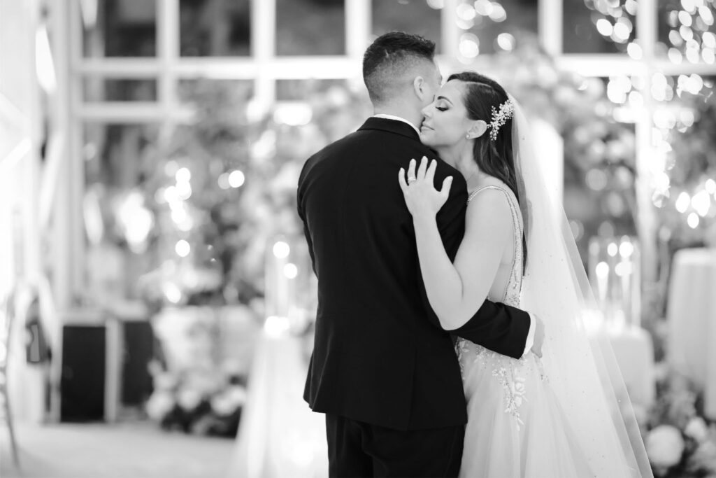 Bride and groom sharing their first dance on the reception floor, captured to showcase the romance preserved through same-day edits.