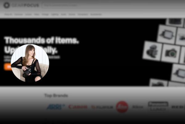 Vanessa Joy holding a camera, featured in an article about The Smarter Way Photographers Buy and Sell Gear.