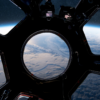 View from the ISS cupola window looking down at Earth — the same vantage point where an astronaut fell in love with photography while orbiting 250 miles above the surface