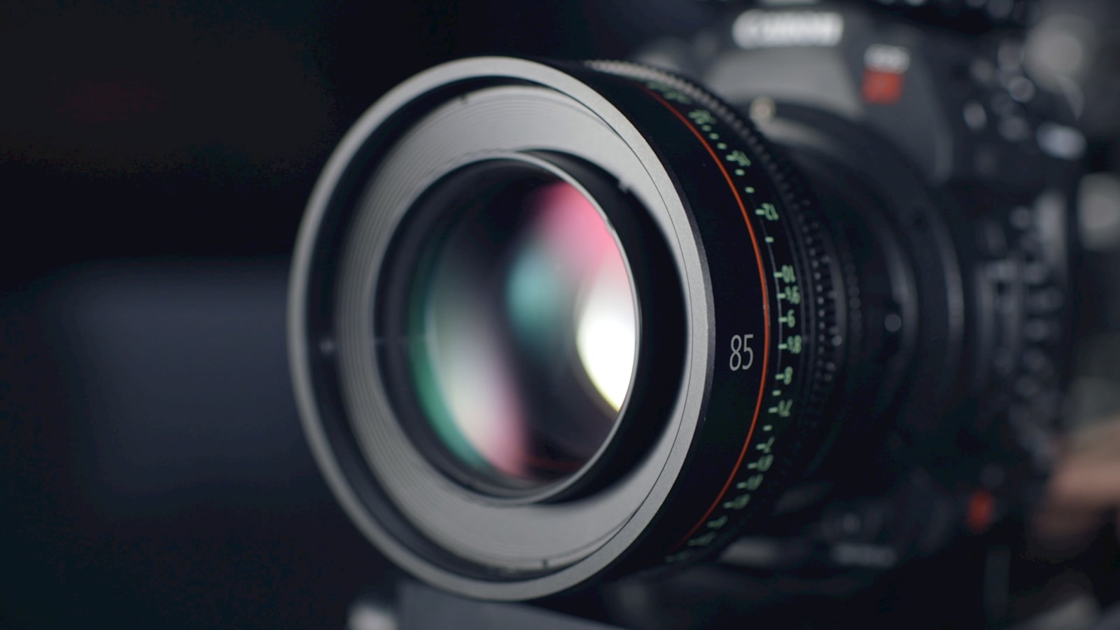 close-up of a telephoto lens mounted on a camera with soft studio lighting